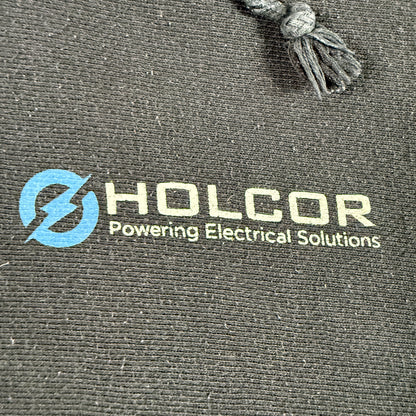 左胸の HOLCOR Powering Electrical Solutions プリント 寄り