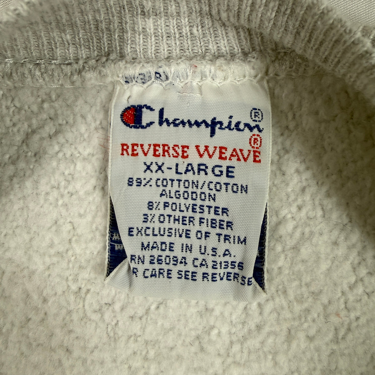 首元の Champion REVERSE WEAVE 刺繍タグ XX-LARGE MADE IN U.S.A.