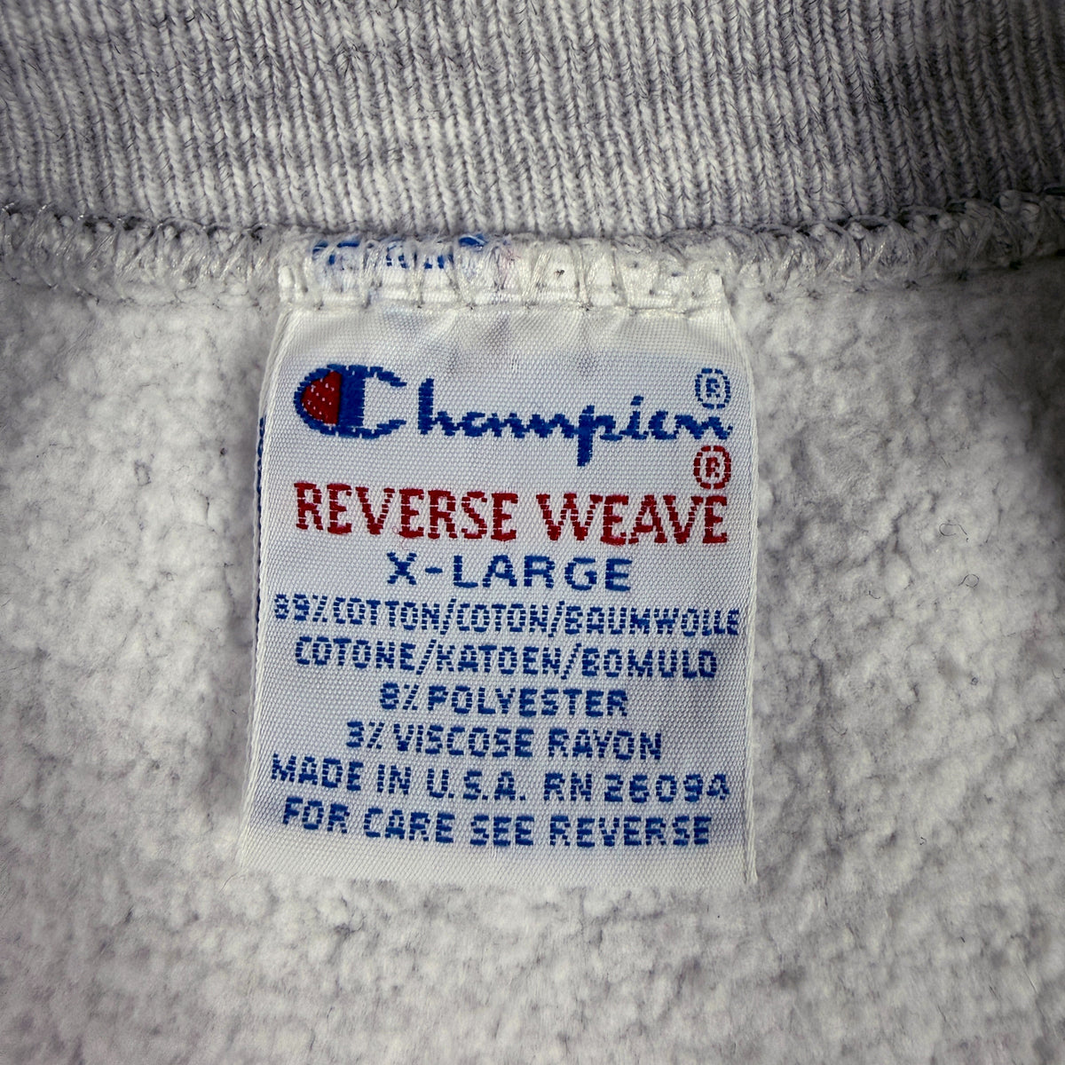 首元の Champion REVERSE WEAVE 刺繍タグ X-LARGE MADE IN U.S.A.