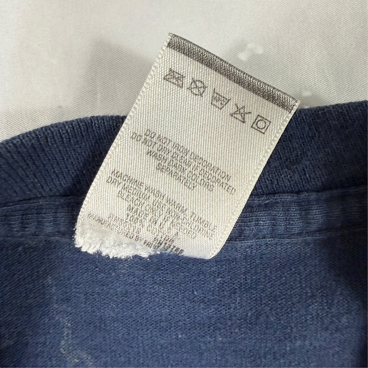 90's MICKEY UNLIMITED ATHLETIC DEPT. ミッキーマウス Tシャツ 洗濯タグ(裏面)