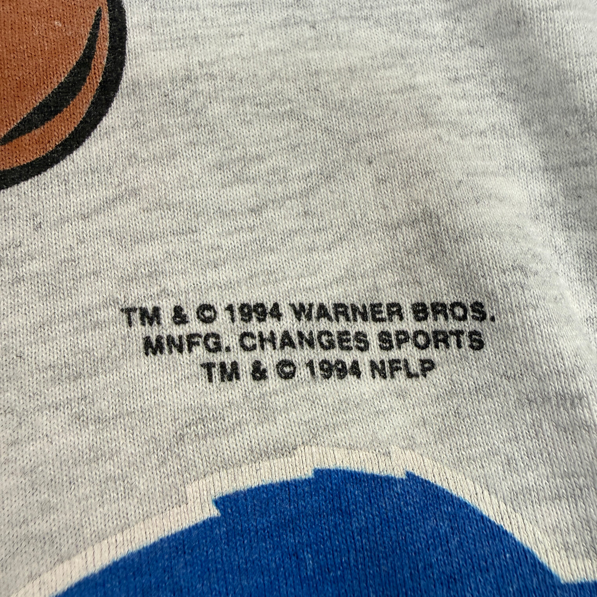 ©1994 WARNER BROS. / MNFG. CHANGES SPORTS / ©1994 NFLP のプリント表記